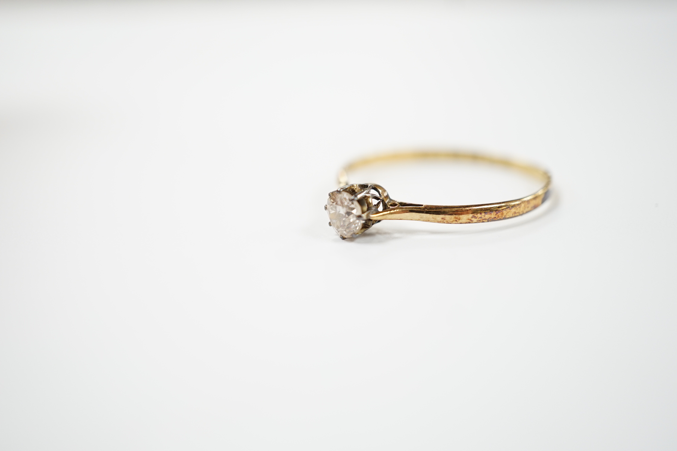 A 1920's 18ct gold and solitaire diamond set ring, size V, gross weight 1.8 grams.